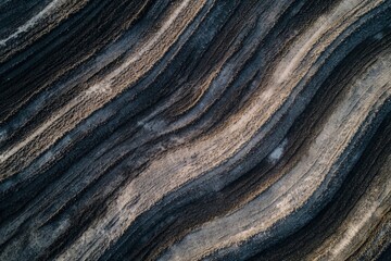 Fototapeta premium Abstract aerial photography showcasing striking formations through earthy textures and hues, revealing artistic processes and creating an emotional connection to the planet.