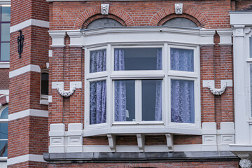 Villa (1884), consisting of three residential buildings in the Flemish Renaissance style with two corner towers and bay windows on Weteringschans 10 - 14. Amsterdam, The Netherland. 