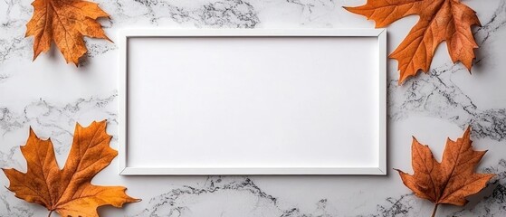 A flat lay design featuring orange autumn leaves and a white frame on a marble background.