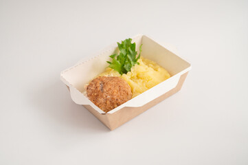 Takeout meals served in biodegradable containers, mashed potatoes with meatball