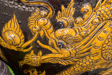 Nonthaburii, Thailand - June, 24, 2024 : Exquisite Black Ceramic Vase with Golden Mythical Dragon Embellishments at Nonthaburii, Thailand.