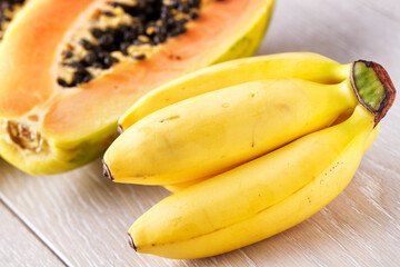 Bunch of Bananas and Papaya Isolated on a Background