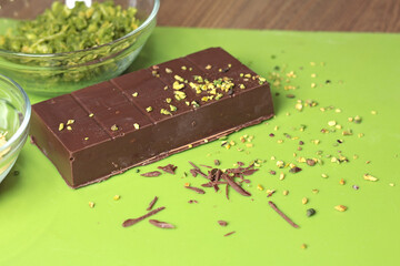 Dubai chocolate with pistachio paste and kataifi dough. Confectionery food and sweets with your own hands at home in the kitchen.
