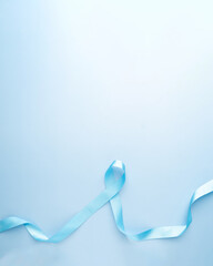Men's health and Prostate cancer awareness campaign in November. Light blue ribbon awareness on sky...