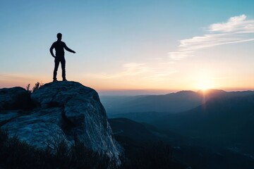 Obraz premium A lone figure stands on a mountain peak with arms raised toward the emerging sunrise, symbolizing triumph, renewal, and the inspiring beauty of the dawn's beginning.