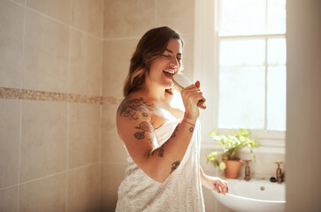 Woman, happy and brush in bathroom for singing, morning routine and excited for self care with...