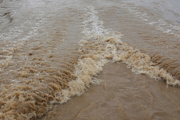 flow of water from the movement of the ship