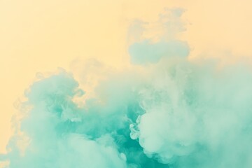 Obraz premium This image showcases a subtle blend of blue mists gently layered on a soft yellow backdrop, conjuring feelings of tranquility and meditation for the observer.