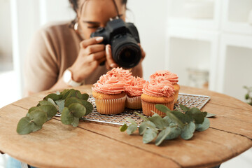 Cupcake, woman and camera for professional photography, creative art and influencer with leaves. Photographer, technology and picture of food in house for dessert blog, content creation and filming