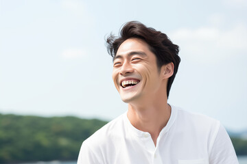 A natural, candid shot of a Korean man laughing, taken mid-laughter with his head tilted back, capturing the spontaneity and joy of the moment.showing expressive eyes and a wide smile. 
