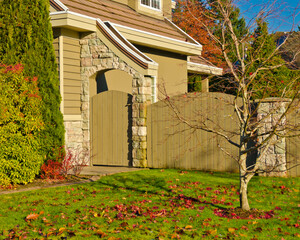 luxury house with garage door, big tree and nice Fall Foliage landscape in Vancouver, Canada