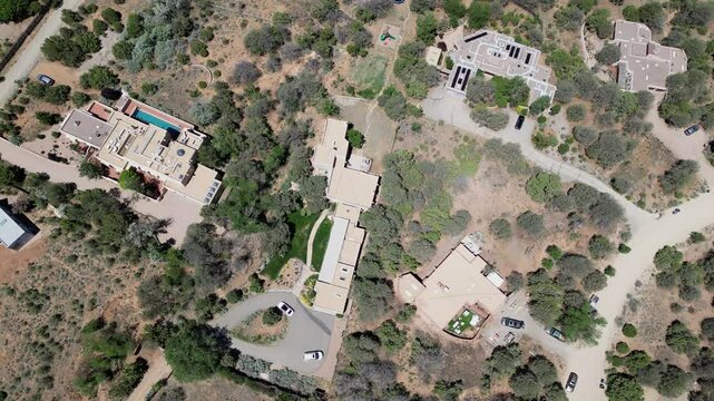 Top down aerial shot of cluster of buildings in desert outside of Santa Fe, New Mexico. USA.