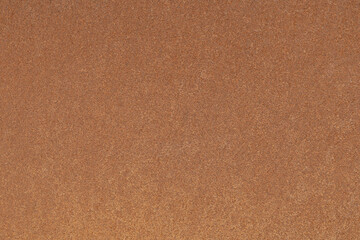 Rusty metal surface with speckled texture and pattern.