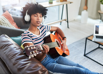 Woman, music and passion with guitar at home for music, production or hobby performance. Girl, talented artist or acoustic guitarist with musical instrument for sound, song and digital rhythm notes