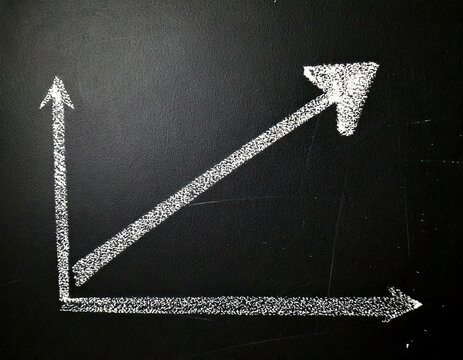 Arrow on a graph indicating business financial economic grow growth increase profit success chalk drawing on a Blackboard Chalkboard Illustration Isolated
