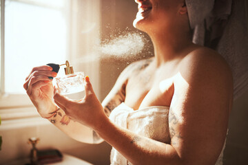 Woman, perfume spray and bathroom with relax, skincare and bottle for scent and fragrance at home....