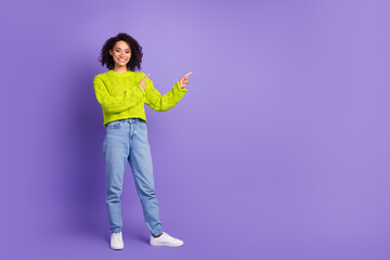 Photo portrait of beautiful charming youth girl in bright green knitted sweater indicating...