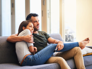 Couple, relax and hug for watching tv at house for streaming movie, film and multimedia...