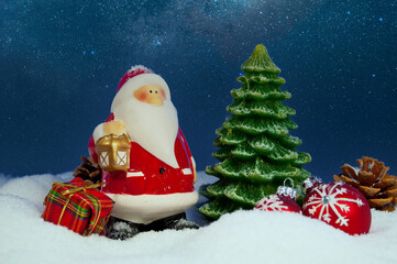 Decorative christmas hangers in front wooden weathered background with slate plate snowflakes and merry christmas