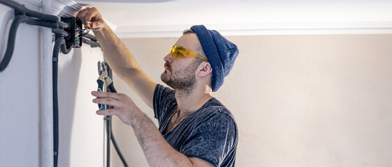 Builder at work. The worker makes repairs.