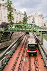 Obraz premium Vienna, Austria - July 23, 2024: The historic Zollamtsbrücke rail and footbridges crossing the Wienfluss canal in the early morning in Vienna 