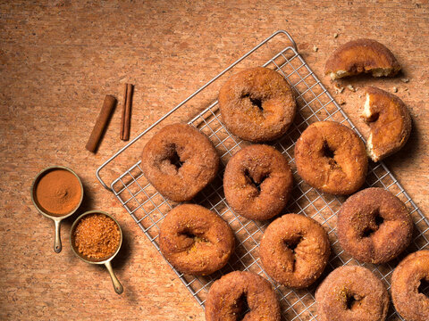 Overhead view of apple cider dougnuts in a monochromatic color palette