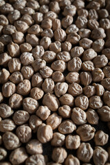 Dried chickpeas on a textured surface background