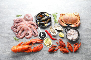 Many different sea food on grey table, flat lay