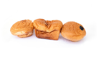 Set fluffy square and round bread with filling inside and sprinkled with white sesame seeds on the top isolated on white background.