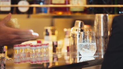 Closeup bartender hand serving in fresh soda gas texture into glass of drink advertisement serving customer at beverage bar counter luxury pub for welcome impression greeting guess service. Vinosity.
