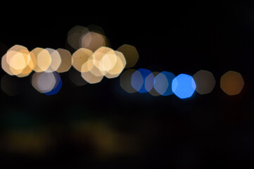 Abstract background of blurred image of night light with bokeh effect from the camera