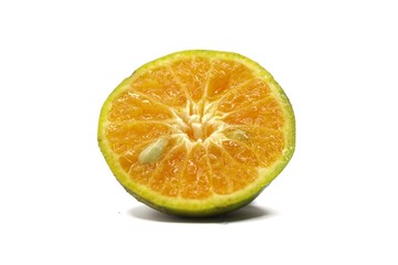 A close-up photo of a halved orange. The orange has a bright orange interior and a slightly green exterior. The photo is taken against a white background.