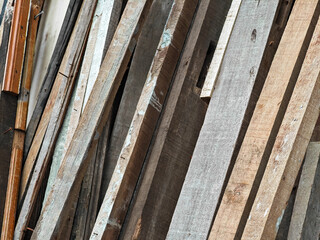 Pile of pieces of scrap wood blocks with nails