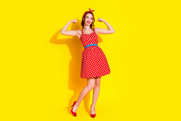 Photo of lovely cute positive strong lady wear red trendy clothes isolated on yellow color background