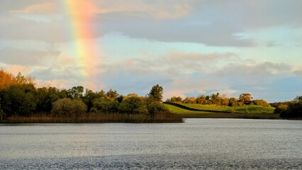 Beautiful lakeside landscape scenery, Rainbow over Ross lake at Rosscahill, Galway, Ireland, nature background