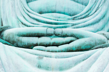 Closeup hand of the great blue buddha statue Daibutsu at Doiprazan temple in Lampang province, Thailand..