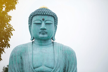 The great blue buddha statue Daibutsu at Doiprazan temple in Lampang province, Thailand..