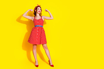 Photo of lovely cheerful funny cute lady wear red trendy clothes look empty space isolated on yellow color background