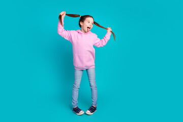 Full body photo of cute little girl dance pull tails have fun dressed stylish pink clothes isolated...