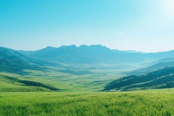 Obraz premium Serene mountain landscape under a clear blue sky