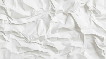 Obraz premium White crumpled paper texture with soft folds and shadows.