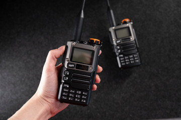 Radio system. Walkie-talkie. Two walkie-talkies. Antenna. Walkie-talkie in hands. Gray background....