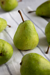 Raw Organic Lucas Pears in a Bunch, side view.