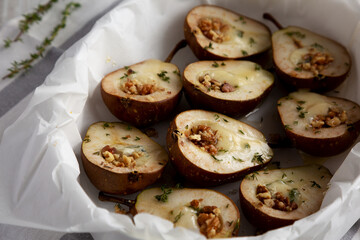 Homemade Blue Cheese Stuffed Pears with Honey, Thyme and Walnuts, side view.