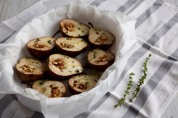Homemade Blue Cheese Stuffed Pears with Honey, Thyme and Walnuts, side view.
