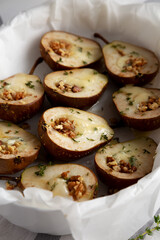 Homemade Blue Cheese Stuffed Pears with Honey, Thyme and Walnuts, side view.