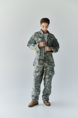 woman prepares for military service, showcasing dedication and patriotism