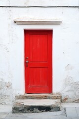 Vibrant Red Door on Classic White Building Facade