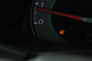 Empty fuel warning light in car dashboard. Fuel pump icon. gasoline gauge dash board in car with digital warning sign of run out of fuel turn on. Low level of fuel show on speedometer dashboard.