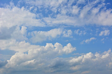 a sky with white clouds and a blue sky in the background banner 